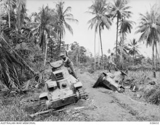 MILNE BAY, PAPUA. 1942-09. JAPANESE TYPE 95 HA-GO LIGHT TANKS USED IN THE ABORTIVE LANDING AT MILNE BAY. THE JAPS TRIED TO BRING THEM ALONG THE NARROW JUNGLE ROAD ABREAST AND THEY BECAME BOGGED IN ..