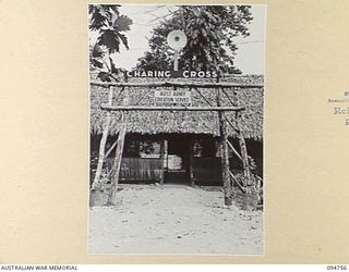 LAE AREA, NEW GUINEA, 1945-08-10. THE ENTRANCE TO THE CHARING CROSS EDUCATION HUT UNDER THE COMMAND OF THE DEPUTY ASSISTANT DIRECTOR OF EDUCATION, LAE BASE SUB-AREA