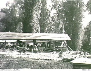 THE SOLOMON ISLANDS, 1945-10-13. INTERNMENT CAMP LIVING QUARTERS FOR JAPANESE NAVAL PERSONNEL. (RNZAF OFFICIAL PHOTOGRAPH.)