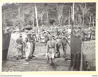 KAIRIRU ISLAND, NEW GUINEA. 1945-09-17. JAPANESE NAVAL OFFICERS EMBARKING ON BARGE FOR TRANSFER TO MUSCHU ISLAND. FOLLOWING THE SURRENDER OF THE JAPANESE THE ISLANDS ARE NOW UNDER THE CONTROL OF HQ ..