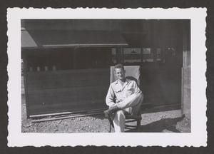 [Henry J. Cates Jr. Sitting on Chair, #2]