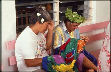 Two women sewing tivaevae