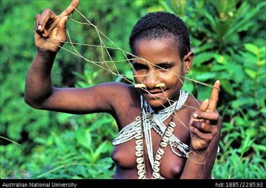 Woman showing string figure game