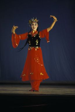 A Chinese People's Liberation Army Air Force Song and Dance Troupe dancer performs at the Waikiki Shell. The troupe is here on the final stop of its US tour