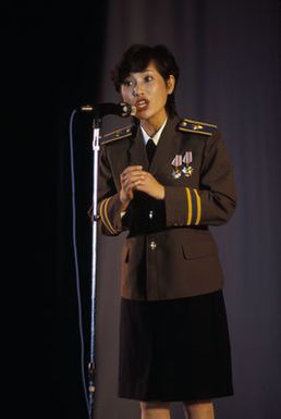 Soprano Jie Houfang of the Chinese People's Liberation Army Air Force Song and Dance Troupe performs at the Waikiki Shell. The troupe is here on the final stop of its US tour