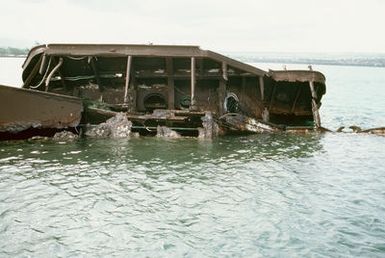 A view of the wreck of the former battleship-target ship USS UTAH (BB-31, AG-16), which was sunk at its moorings on the west side of Ford Island on December 7, 1941, during the Japanese attack on Pearl Harbor