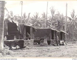 NORTH ALEXISHAFEN, NEW GUINEA. 1944-09-14. A NEAT LINE-UP OF MOBILE STORES TRUCKS AT THE 133RD BRIGADE ORDNANCE FIELD PARK. IDENTIFIED PERSONNEL ARE: NX110628 CORPORAL A.D. LAWRENCE (1); NX156671 ..