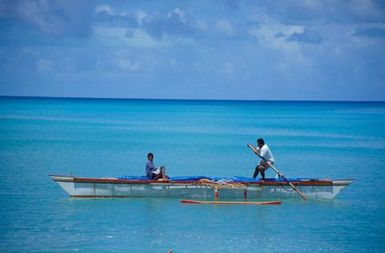 Canoes sailing