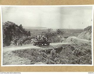 MILNE BAY, NEW GUINEA, 1943-07-12. A CORNER OF HILL STATION ROAD, LOOKING SOUTHEAST ACROSS TURNBULL'S DROME