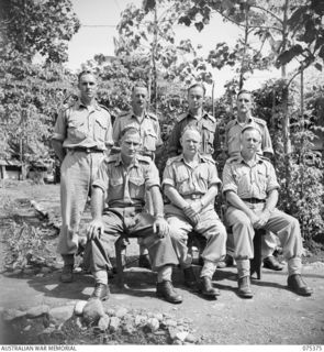 LAE, NEW GUINEA. 1944-08-19. OFFICERS OF THE SUPPLY AND TRANSPORT SECTION, HEADQUARTERS, NEW GUINEA FORCE. IDENTIFIED PERSONNEL ARE:- VX108086 CAPTAIN W.B. BALLARD, ADJUTANT (1); VX45177 MAJOR T.A. ..