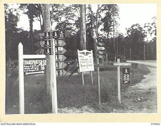BOUGAINVILLE ISLAND. 1945-03-09. SIGNS ERECTED AT THE JUNCTION OF THE DIVISION AND AMERICAL ROADS NEAR HEADQUARTERS, 15TH INFANTRY BRIGADE