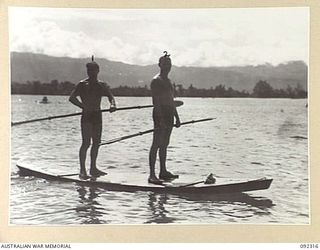 JACQUINOT BAY, NEW BRITAIN, 1945-05-20. CAPTAIN K. ROWE, ARMY AIRWAYS COMMUNICATIONS SYSTEM (1), WITH LIEUTENANT L.F.C. BLUNT (2), WAITING TO PUSH OUT INTO THE STREAM FOR THE START OF THE DOUBLE ..