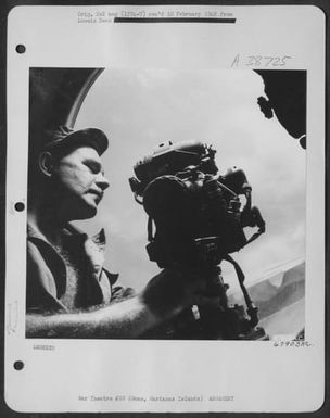 Sgt. Karl Neukirch Checks The Gun Sight In The Right Waist Blister On A Boeing B-29 "Superfortress". North Field, Guam, Marianas Islands, 4 April 1945. (U.S. Air Force Number 67903AC)