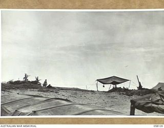 SALAMAUA, NEW GUINEA, 1943-09-26. CAPTURED JAPANESE GUN EMPLACEMENTS ON THE BEACH NEAR LOGNI ROAD