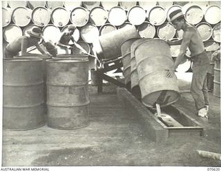 PORT MORESBY, PAPUA. 1944-02-25. THE 44-GALLON DRUM WASHING PLANT OPERATING AT THE BULK OIL INSTALLATION OF THE 1ST PETROLEUM STORAGE COMPANY