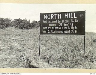 FINSCHHAFEN AREA, NEW GUINEA. 1944-03-13. ONE OF MANY BATTLE SIGNS IN THE FINSCHHAFEN AREA, THIS SIGN AT NORTH HILL RECORDS THE ACTIVITIES OF "B" COMPANY, 2/17TH INFANTRY BATTALION, "C" COMPANY, ..