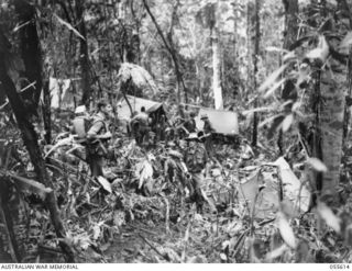 Staging camp of the 2/7th Battalion. In the foreground are:- QX28974 Private (Pte) Cyril Ernest Trute(left)  and  WX13755 Pte Arthur Henderson Brown Tindale