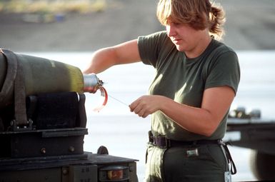 AIRMAN 1ST Class Laura Washnesky defuses Mark 82 500-pound laser-guided bombs for removal from a munitions cart. The bombs will be loaded on an F-16 The bombs will be loaded on an F-16 Fighting Falcon aircraft during exercise COPE ELITE '81