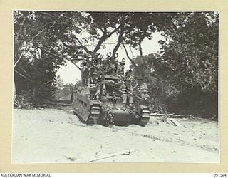 KALIMBOA, AITAPE-WEWAK SECTOR, NEW GUINEA. 1945-04-26. PERSONNEL OF 2/1 FIELD COMPANY, ROYAL AUSTRALIAN ENGINEERS, WHO CLEARED MINES RIDING BACK TO CHOLIAL ON A 2/4 ARMOURED REGIMENT MATILDA TANK. ..