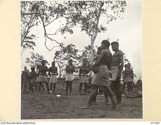 BISIATABU, NEW GUINEA. 1944-05-23. NATIVE TROOPS OF THE PAPUAN INFANTRY BATTALION PARTICIPATING IN A TRAINING EXERCISE ON THE OWEN GUN. IDENTIFIED PERSONNEL ARE:- 259 CORPORAL KAIAU (1); 236 ..