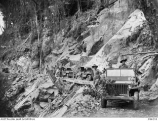 REINHOLD HIGHWAY, NEW GUINEA. 1943-08-23. JEEP CONVOY OF HEADQUARTERS, ROYAL AUSTRALIAN ENGINEERS, 11TH AUSTRALIAN DIVISION, THE FIRST CONVOY TO TRAVERSE THE NEW HIGHWAY, PHOTOGRAPHED AT PARER'S ..