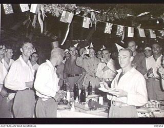 RABAUL, NEW BRITAIN, 1945-12-27. PATIENTS OF 118TH AUSTRALIAN GENERAL HOSPITAL ENJOYING A BUFFET TEA WHICH INCLUDED ICE CREAM AND CORDIAL FLOWN FROM AUSTRALIA. THE SOCIAL EVENING WAS GIVEN BY THE ..