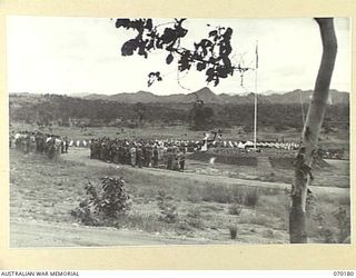 PORT MORESBY, NEW GUINEA. 1944-02-07. WX17091 CHAPLAIN C.W. CUNNINGHAM, MBE., (ROMAN CATHOLIC) (1), COMMENCING REQUIEM MASS AT BOMANA WAR CEMETERY