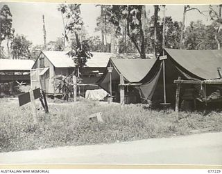 TOROKINA, BOUGAINVILLE ISLAND. 1944-11-25. A SECTION OF THE TEMPORARY CAMP OF HEADQUARTERS, 2ND AUSTRALIAN CORPS IMMEDIATELY AFTER THE UNITS ARRIVAL FROM LAE, NEW GUINEA. SEEN ARE:- MILITARY ..