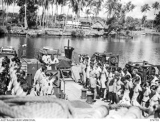 MADANG, NEW GUINEA. 1944-10-26. DIVINE SERVICE BEING CONDUCTED BY LIEUTENANT-COMMANDER C.G. HILL, ABOARD THE RAN FRIGATE, BARCOO