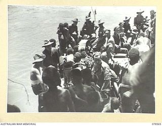 BOUGAINVILLE AREA. 1945-01-22. NATIVE WOMEN AND CHILDREN WHO HAVE BEEN RESCUED FROM THE JAPANESE IN THE SOUTHERN BOUGAINVILLE AREA BEING PLACED ABOARD BARGES FOR TRANSPORT TO THE MOUTH OF THE JABA ..