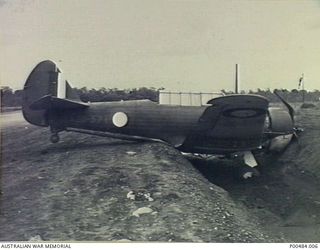 12 MILE STRIP, PORT MORESBY, NEW GUINEA, C.1943. WIRRAWAY A20-571 IN A DITCH