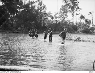 HANSA BAY, NEW GUINEA. 1944-09-06. MEMBERS OF A PATROL FROM C COMPANY, 25TH INFANTRY BATTALION CROSSING THE BOT BOT RIVER NEAR THEIR CAMP ON THEIR RETURN FROM A THREE DAY TREK THROUGH THE RAMU ..