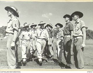 NX102477 Lieutenant Colonel K A McGarrity, Commanding Officer, 18th Field Ambulance (1) inspecting members of B Company, accompanied by the officer in charge, TX6468 Captain P Zerman (2) and the ..