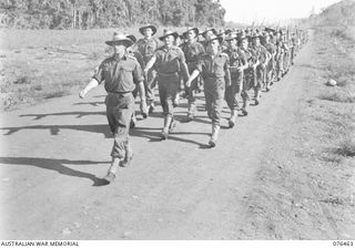 LAE, NEW GUINEA. 1944-10-07. A MARCH PAST OF THE 2/8TH COMMANDO SQUADRON. IDENTIFIED PERSONNEL ARE:- QX16381 CAPTAIN C.J.P. DUNSHEA, MC, (1); LANCE CORPORAL J.M. SEWARD (2); NX124693 LIEUTENANT ..