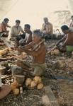 Elders and men making craft objects.