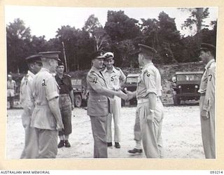 JACQUINOT BAY, NEW BRITAIN, 1945-06-16. THE GOVERNOR GENERAL OF NEW ZEALAND, MARSHAL OF THE ROYAL AIR FORCE, SIR CYRIL L.N. NEWALL (4) BEING GREETED BY MAJ-GEN H.C.H. ROBERTSON, GOC 5 DIVISION (2), ..