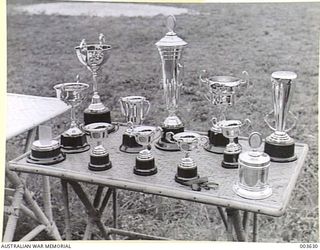 PORT MORESBY - TROPHIES AT A.A.C. SPORTS. RAAF SURVEY FLIGHT. (NEGATIVE BY N. TRACY)