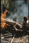 Heating log to remove bark