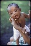 Young infant wearing a cloth diaper