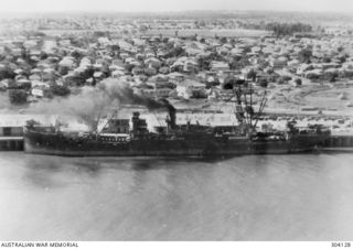 AERIAL PORT SIDE VIEW OF THE AMERICAN CARGO VESSEL WEST CACTUS WHICH TOOK PART IN THE MILNE BAY OPERATIONS OF 1942-09. (NAVAL HISTORICAL COLLECTION)