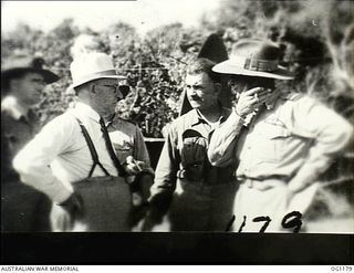 AITAPE, NORTH EAST NEW GUINEA. C. 1944-06. LEFT TO RIGHT: ARTHUR DRAKEFORD, THE MINISTER FOR AIR, JOHN DEDMAN, THE MINISTER FOR WAR ORGANISATION OF INDUSTRY, AND AIR COMMODORE F. R. W. SCHERGER, ..