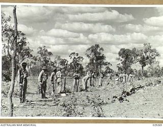 TOWNSVILLE, AUSTRALIA. 1942-11. "GUINEA PIGS" AT THE TARGET AREA BEFORE THE COMMENCEMENT OF THE DEMONSTRATION GAS SHELL SHOOT BY 5TH FIELD REGIMENT, ROYAL AUSTRALIAN ARTILLERY