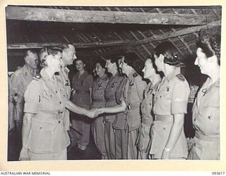 JACQUINOT BAY, NEW BRITAIN, 1945-07-02. HIS ROYAL HIGHNESS, THE DUKE OF GLOUCESTER, GOVERNOR-GENERAL OF AUSTRALIA (2), HAD AFTERNOON TEA WITH THE SISTERS DURING HIS VISIT TO 2/8 GENERAL HOSPITAL. ..