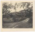 Man standing in front of house, Bogail, Kavieng