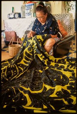 A woman sewing a tivaevae manu, Cook Islands