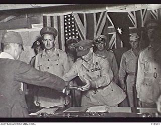 TOROKINA, BOUGAINVILLE. 1945-09-08. LIEUTENANT-GENERAL (LT-GEN) S. G. SAVIGE, GENERAL OFFICER COMMANDING 2 CORPS, ACCEPTED THE SURRENDER OF ALL JAPANESE FORCES ON BOUGAINVILLE FROM LT-GEN M. KANDA, ..
