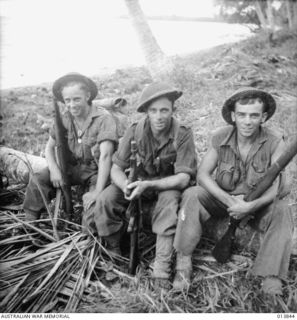 Gona, Papua, 1942-12-16. The three Chapman brothers of South Australia, who all joined the 2/27th Infantry Battalion, pause for a break just after the fall of Gona. Left to right: SX12357 Pte ..