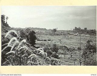 LAE. NEW GUINEA. 1944-07. ONE OF A NUMBER OF PHOTOGRAPHS TAKEN TO GIVE A 120 PANORAMIC VIEW OF THE TOWN OF LAE. TO JOIN TO PHOTOGRAPHS NO. 74636, 74637, 74638, 74639 AND 74640