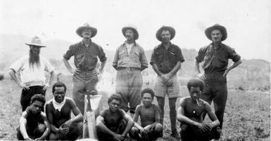 Christmas cricket team, Mogei Mission, Mount Hagen, 1934-1935, back row, Father Ross, Fox, Brother Eugene, Dan Leahy, Fox, and front row, Alexishafen natives [A.J. Bearup]