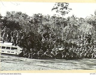 KILIGIA, NEW GUINEA. 1944-03-16. MEMBERS OF A SQUADRON, 1ST TANK BATTALION, 5TH DIVISION, WITH MATILDA TANKS AT THE BACKGROUND